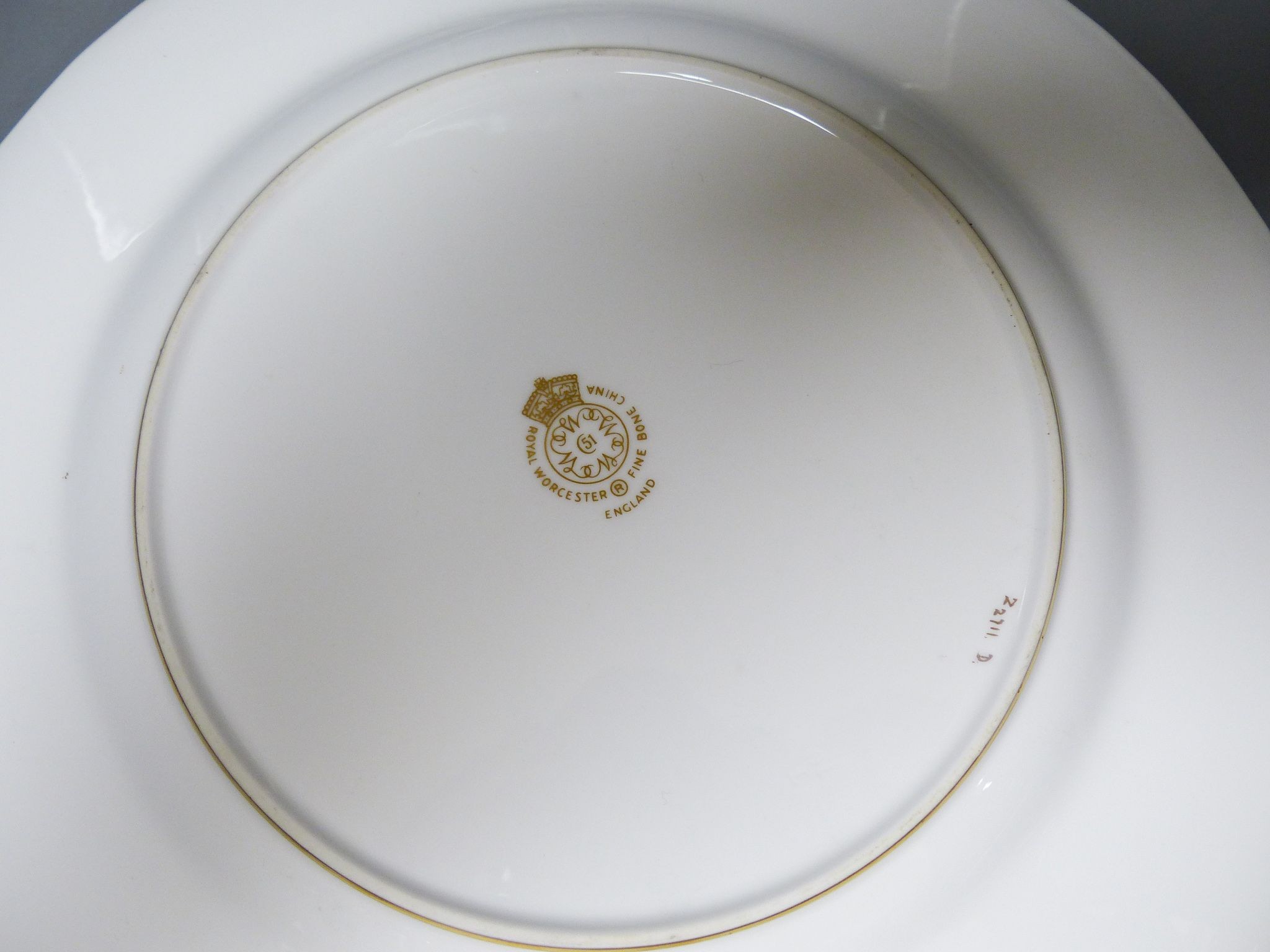 A Royal Worcester fruit painted and gilt tooled cabinet plate, post war, signed Telford, 27.5 cm